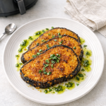 Air Fryer Polenta Crusted Eggplant Steaks with Basil Oil